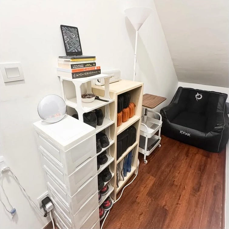  Interior view of a 45-square-foot room featuring a single bed and organized shelving.
