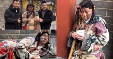 Professional actor Li Jinxiao dressed in tattered Song Dynasty clothing at the Millennium City Park in Kaifeng, China.