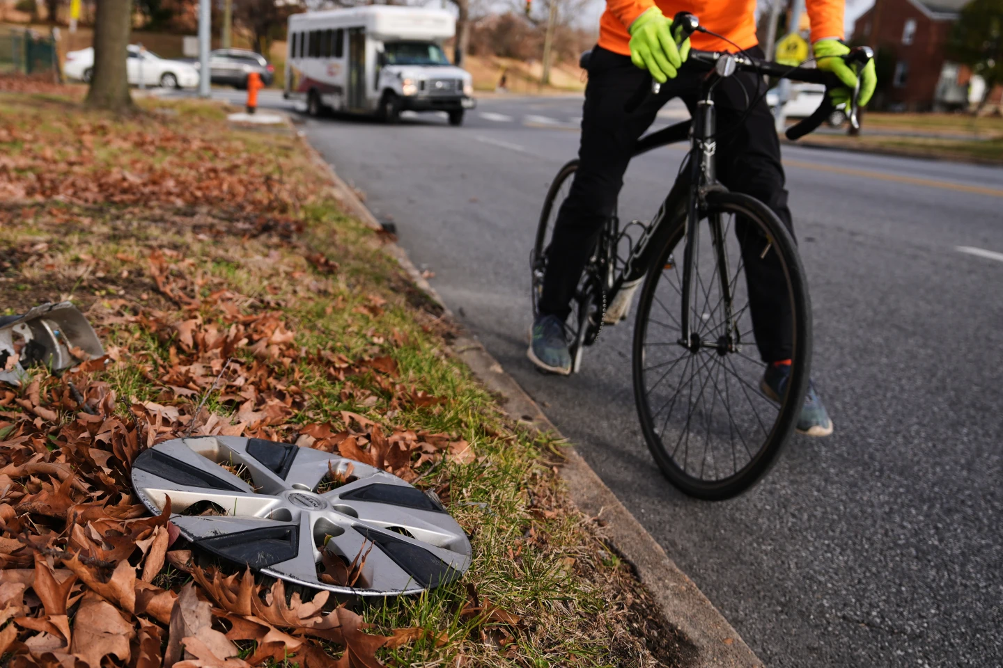 A completed section of the hubcap art wall featuring various sizes and styles of car wheel covers.